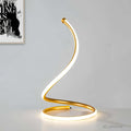 glowspiral-goldene-led-tischlampe-modern-spiralförmig-lichtquelle-wohnzimmer-xlumina